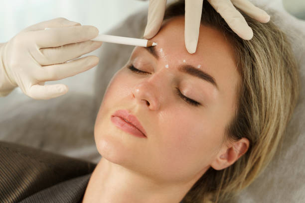Woman getting eyebrow injections